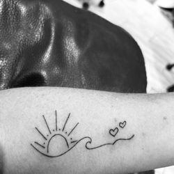Island Time Tattoo - Alex added the sun and hearts to my existing wave.   I love it and it means so much more to me because he drew it.