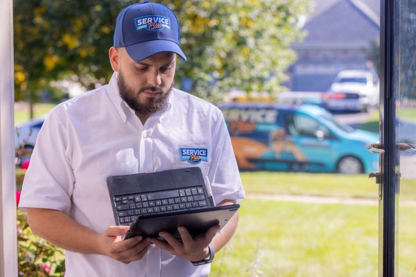 Service Plus Heating & Cooling Logo