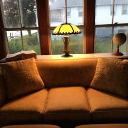 Gozzo Antiques & Restorations - This couch needed structural repair and new upholstery; Gozzo also built the marble table for our lamp, dictionary, & globe. Perfection.