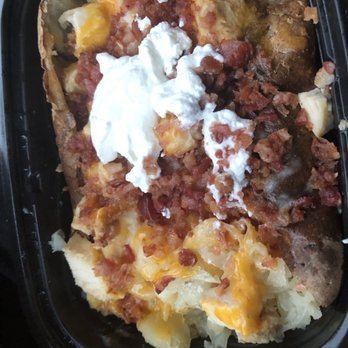The Potato Place - Steak, cheese, green peppers, and other items. I added the sour cream on top. - American Near Me - Detroit, Michigan The Potato Place - Steak, cheese, green peppers, and other items. I added the sour cream on top. - American Near Me - Detroit, Michigan