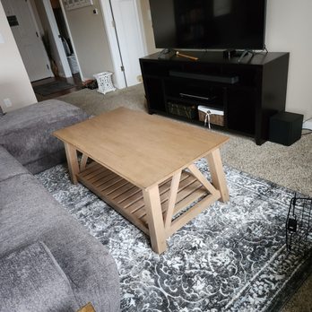 Carpet Liquidators - a living room with a couch, coffee table, and television - Flooring Near Me - Bellingham, Washington Carpet Liquidators - a living room with a couch, coffee table, and television - Flooring Near Me - Bellingham, Washington