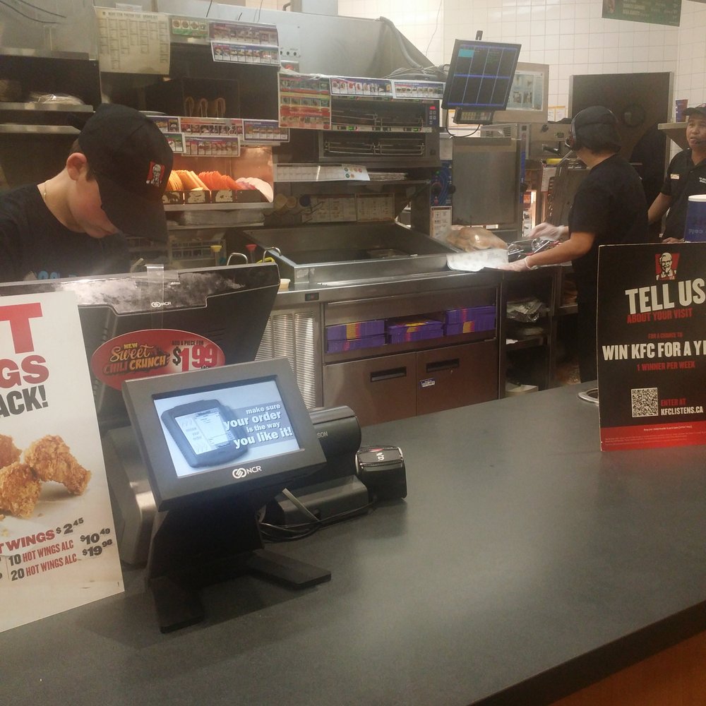 a man ordering food at a fast food restaurant