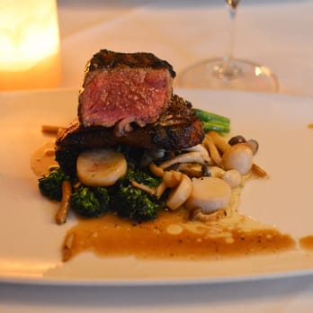 Bouchon - Grilled American Wagyu New York, sautéed exotic mushrooms, seared broccolini, herb compound butter, demi-glace. - French Near Me - Santa Barbara, California