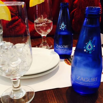 Restaurant Marathon Souvlaki - a glass of water and a bottle of zagori - Mediterranean Near Me - Laval, Quebec Restaurant Marathon Souvlaki - a glass of water and a bottle of zagori - Mediterranean Near Me - Laval, Quebec