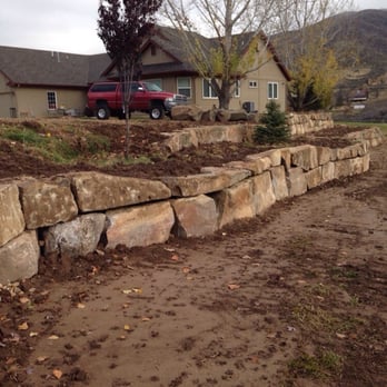 Rock Placing Company - Retaining wall splitting into two tiers. - Building Supplies Near Me - Meridian, Idaho Rock Placing Company - Retaining wall splitting into two tiers. - Building Supplies Near Me - Meridian, Idaho