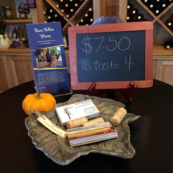Raven Hollow Winery - a blackboard with a price sign and a pile of books - Wineries Near Me - Westfield, Massachusetts Raven Hollow Winery - a blackboard with a price sign and a pile of books - Wineries Near Me - Westfield, Massachusetts