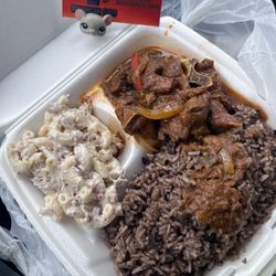 La Torre De Control Dominican Food - Dominican Chivo, rice and macaroni salad. Mmmm slurpy and yummy