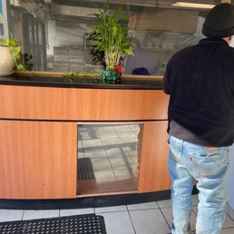 a man standing in front of a counter