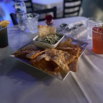 Backstage Atlanta - a plate of chips and a drink on a table - Southern Near Me - Atlanta, Georgia