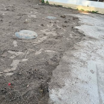 Premium Plumbing - The cracked concrete also demonstrates where the ground (once leveled) now reflects a pronounced depreciation & lack of soil. - Plumbing Near Me - Tampa, Florida Premium Plumbing - The cracked concrete also demonstrates where the ground (once leveled) now reflects a pronounced depreciation & lack of soil. - Plumbing Near Me - Tampa, Florida