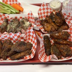 JD's Wingz & Thingz - Garlic parm, mango habanero top and bottom is lemon pepper and dirty buffalo