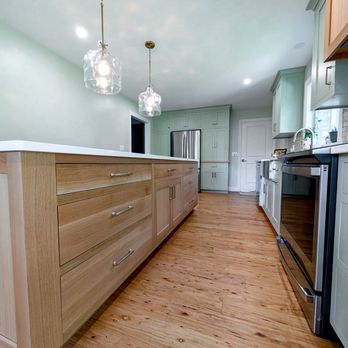 Blue Cord Contracting - Custom rift-cut white oak kitchen island cabinets. Inset, shaker style kitchen cabinets. - Kitchen & Bath Near Me
