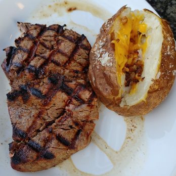 1933 Lounge - 12oz Filet Med Well with baked potato. - Steakhouses Near Me - Fishers, Indiana