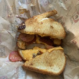 a bacon and cheese sandwich in a wrapper a bacon and cheese sandwich in a wrapper