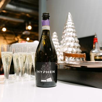 HYPHEN - New ad agency name HYPHEN on champagne bottle - Web Design Near Me - Fresno, California HYPHEN - New ad agency name HYPHEN on champagne bottle - Web Design Near Me - Fresno, California