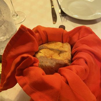 Trattoria Bella - Hot bread comes out in a little tomato can. - Italian Near Me - Palm Bay, Florida Trattoria Bella - Hot bread comes out in a little tomato can. - Italian Near Me - Palm Bay, Florida