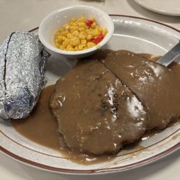 Meatloaf with baked potato and corn