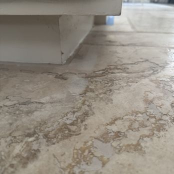 Rodriguez Classic Structure Construction - Bottom cabinets poorly painted and paint sprayed on new tile - General Contractors Near Me