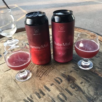 Mothfire Brewing - Outdoor seating with the Jamming and Ruby mist. The Jamming mist was poured into both glasses in this pic. - Breweries Near Me - Ann Arbor, Michigan