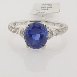 Professional Jewelers - Deep Blue Tanzanite with accent side Diamonds in 18k White gold