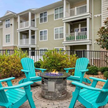 Colony at Centerpointe - Fire pit seating area with turquoise chairs - Apartments Near Me - Midlothian, Virginia Colony at Centerpointe - Fire pit seating area with turquoise chairs - Apartments Near Me - Midlothian, Virginia