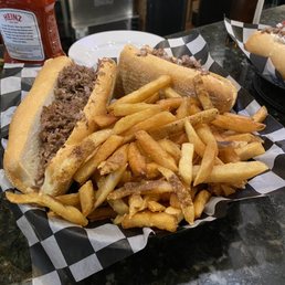 Cheesesteak Sandwich and Fries Cheesesteak Sandwich and Fries
