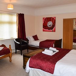 St Aubyns - Large Family Room has a king size and two single beds with an en-suite shower room. An additional single bed can also be provided.