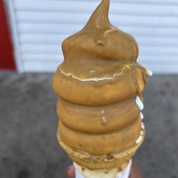 Conny's Creamy Cone - Vanilla soft serve with peanut butter dip of the week!