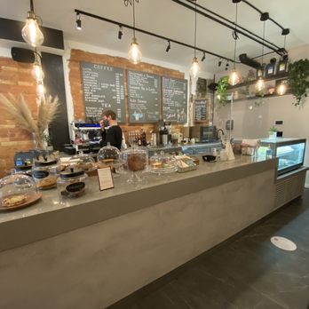 AM Coffee Studio - a counter with a variety of items on it - Coffee & Tea Near Me - Toronto, Ontario