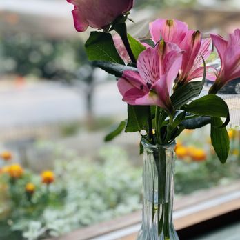 Terrapin Restaurant - a vase of flowers in front of a window - New American Near Me - Rhinebeck, New York Terrapin Restaurant - a vase of flowers in front of a window - New American Near Me - Rhinebeck, New York