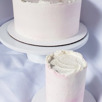 Shura Good Cake - two cakes on plates - Desserts Near Me Shura Good Cake - two cakes on plates - Desserts Near Me