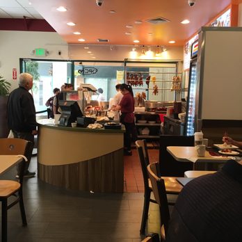 C & M Bistro - Picture of the front counter, where you can get takeout from the trays, or order their delicious meats. - Cantonese Near Me - Oakland, California