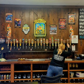Lost Coast Brewery Taproom - Beer maid filling an order - Breweries Near Me - Eureka, California