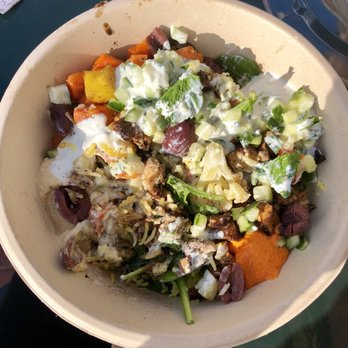 CAVA - Bowl with rice, greens, veggies, chicken, hummus, tzatziki, lemon dill sauce, kalamata olives, and mint!! - Mediterranean Near Me - Los Angeles, California