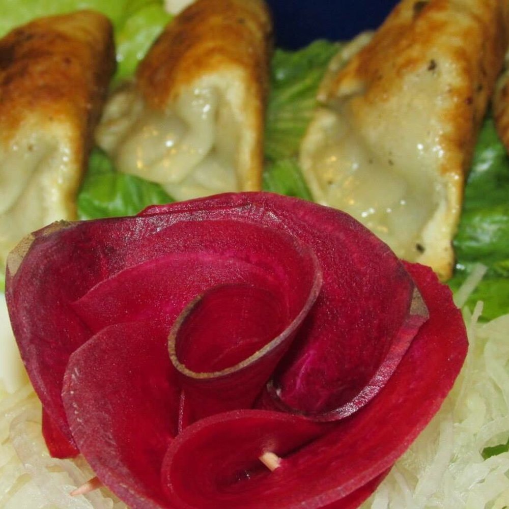 Tokyo Asia Fusion - Food art. And pot stickers. - Sushi Bars Near Me - Abilene, Texas