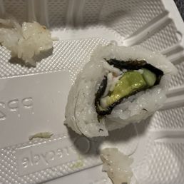 Hair noted on the left lower portion of the California roll.
