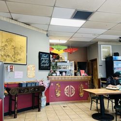 Joy Luck - Guy making egg rolls