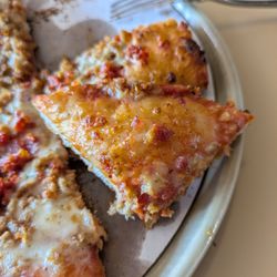 Pizza King - Piece of pizza with no cheese or toppings. How can you still use the slogan - to the edge