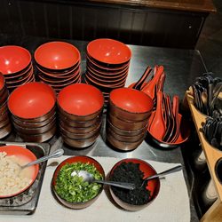 Aji Sushi - Miso soup fixings (diced tofu, green onions, dried wakame), bowls, and spoons