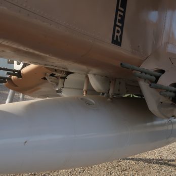 Estrella Warbird Museum - Machine guns and centerline fuel tank. - Museums Near Me - Paso Robles, California