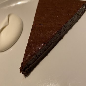 Uccellino - Amedei chocolate budino with whipped creme fraiche....awesome way to end a fabulous dinner. - Italian Near Me - Edmonton, Alberta