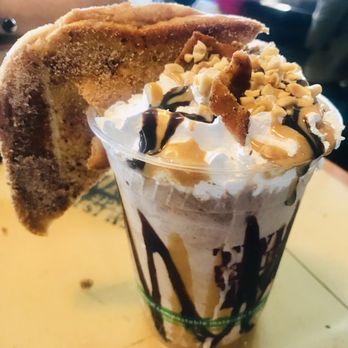Twisted Root Burger - Fat Elvis shake with half a fried peanut butter banana sandwich. - Burgers Near Me - Carrollton, Texas Twisted Root Burger - Fat Elvis shake with half a fried peanut butter banana sandwich. - Burgers Near Me - Carrollton, Texas