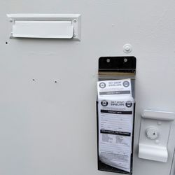 Bavarian Imports - Envelopes and door slot for weekend and after-hours key drop.