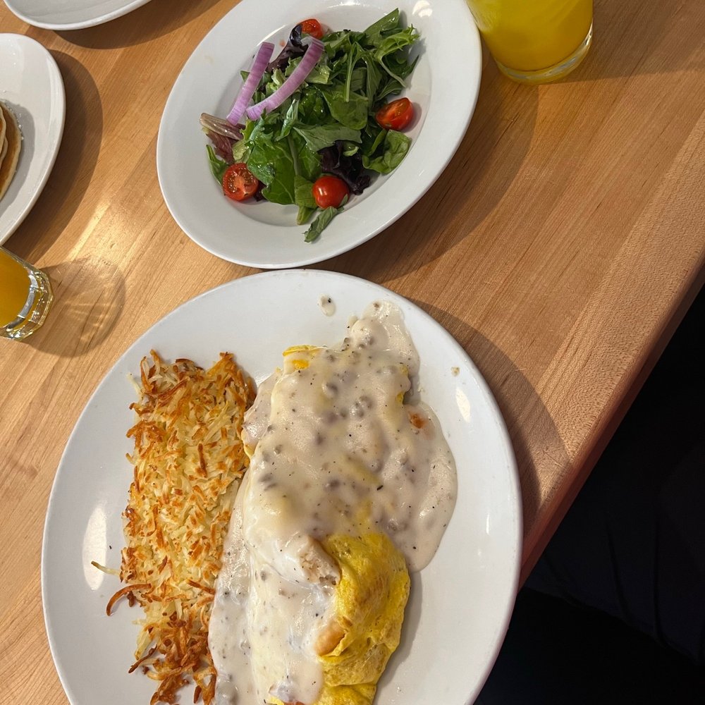 Eggsquisite Cafe - Biscuit & Gravy Omelet with a side salad - Breakfast & Brunch Near Me - McKinney, Texas