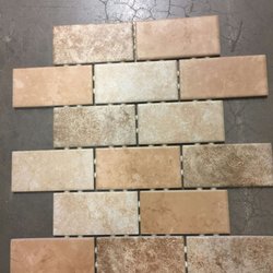 Joe's Landscape & Handyman Services - This is the tile for the bathroom floor before they ruined it by grouting and letting it dry.