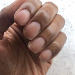 This is a manicure without polish. The shapes and lengths are inconsistent.