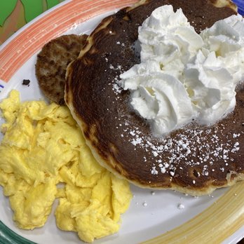 Juno Beach Cafe - Chocolate chip pancakes, eggs and sausage - Breakfast & Brunch Near Me - Juno Beach, Florida