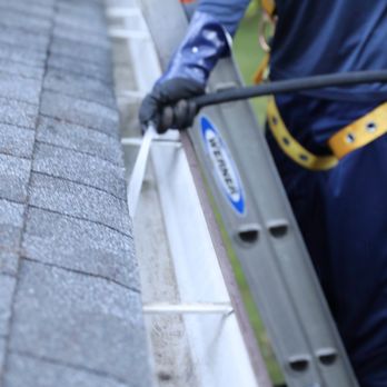 Ned Stevens Gutter Cleaning - Technician flushing gutter system to clear debris and restore proper water flow - Gutter Services Near Me - Burlington Township, New Jersey Ned Stevens Gutter Cleaning - Technician flushing gutter system to clear debris and restore proper water flow - Gutter Services Near Me - Burlington Township, New Jersey