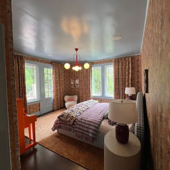 TRU Lighting & Electrical Services - A colorful bedroom with patterned wallpaper, glossy blue ceiling, and an orange piano is brightened by a red multi-globe chan... - Electricians Near Me - Holly Springs, Georgia TRU Lighting & Electrical Services - A colorful bedroom with patterned wallpaper, glossy blue ceiling, and an orange piano is brightened by a red multi-globe chan... - Electricians Near Me - Holly Springs, Georgia