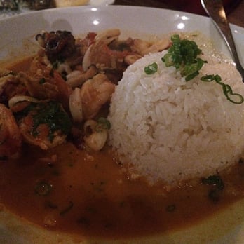 Aji Peruvian Cuisine - Pescado a lo Macho: Fish of the day, shrimp, calamari, octopus, spicy sofrito on rice - Peruvian Near Me - Long Beach, California